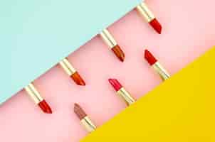 Free photo different lipsticks on colorful background