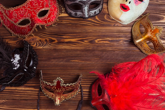 Different masks on wooden table