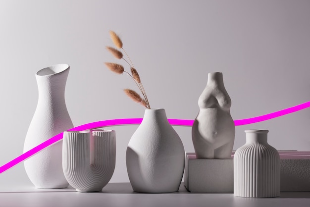Different modern vases and pink line