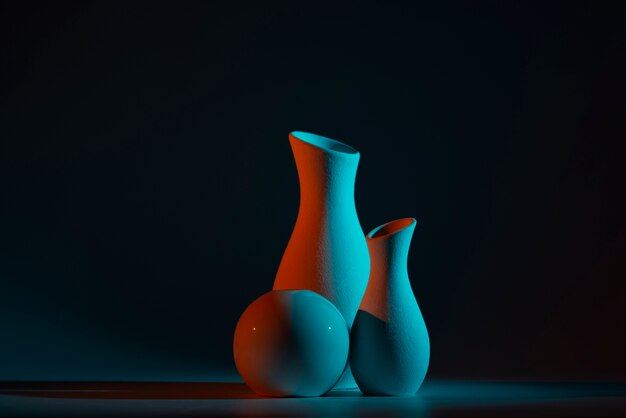 Different modern vases with blue and red light