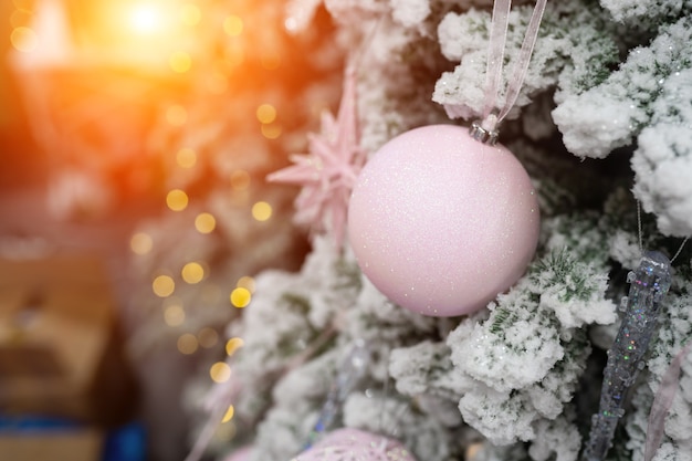 Different object toy gifts hanging on a decorated christmas tree