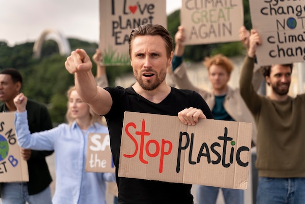 Free photo different people joining a global warming protest