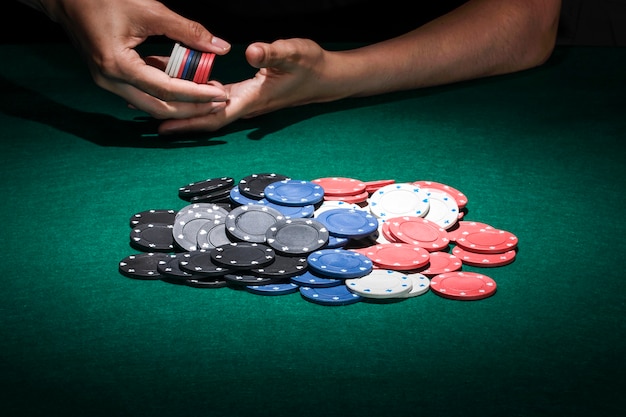 Different poker chips on casino table