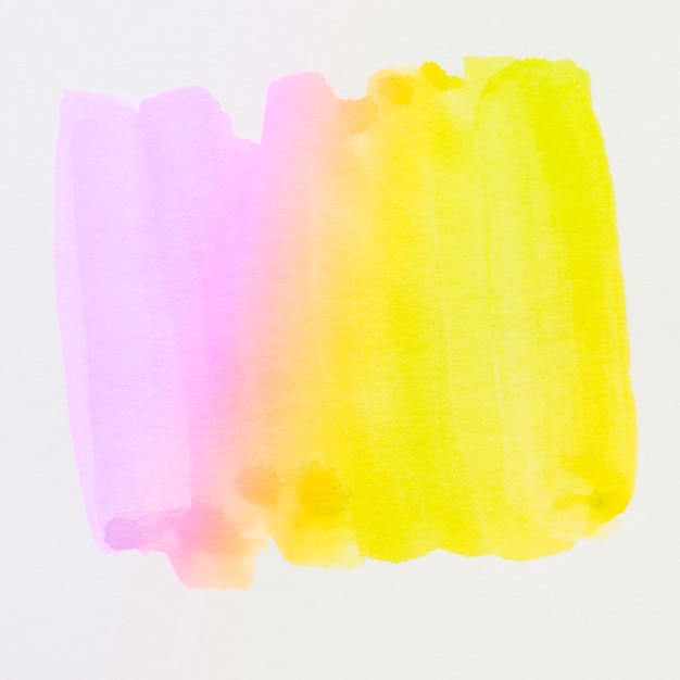 Бесплатное фото Различные фиолетовые и желтые мазки акварели на белом фоне