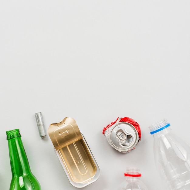 Different recyclable waste on white background