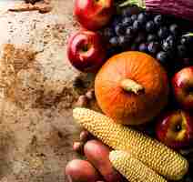 Free photo different seasonal autumn vegetables and fruits old background