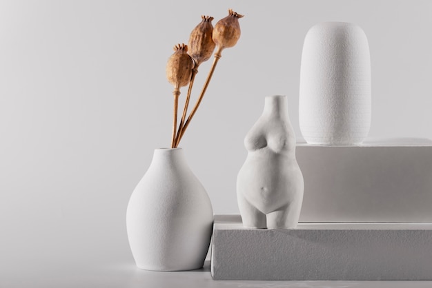 Different shaped white modern vases arrangement