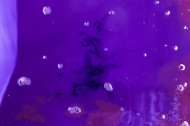 Different tones of purple liquid with foam 