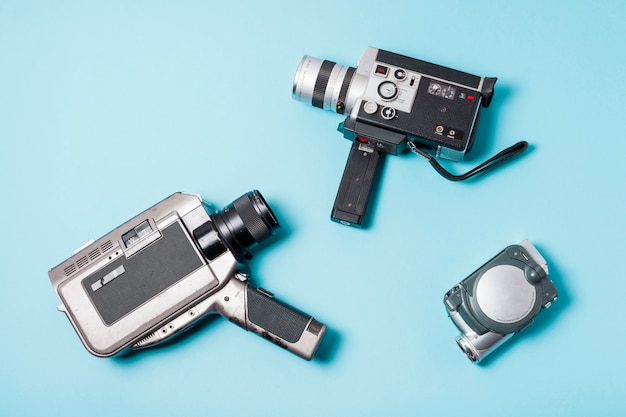 Different type of camcorder on blue background