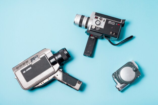 Different type of camcorder on blue background