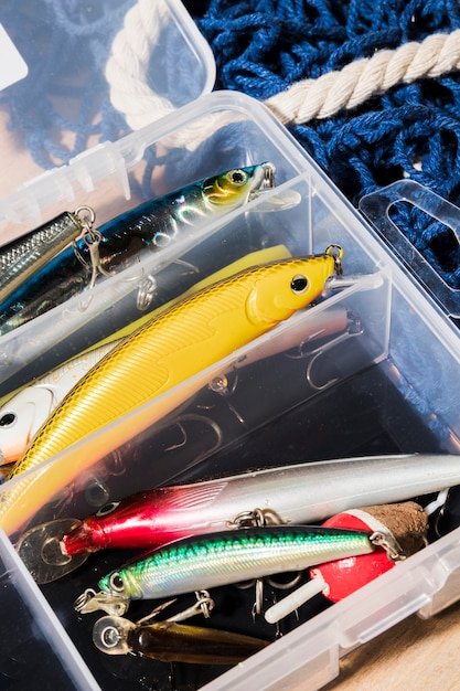 Free photo different type of fishing lures in the white container