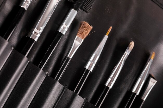 Different type of makeup brushes in a row