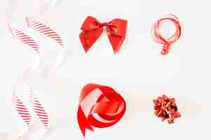 Free photo different type of red ribbons on white background