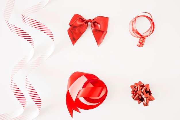 Different type of red ribbons on white background