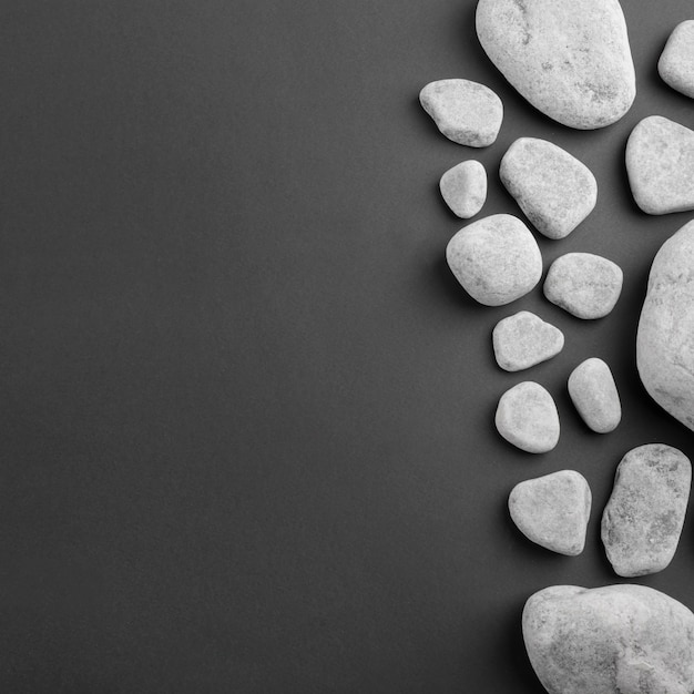 Different type of spa gray stones on black background