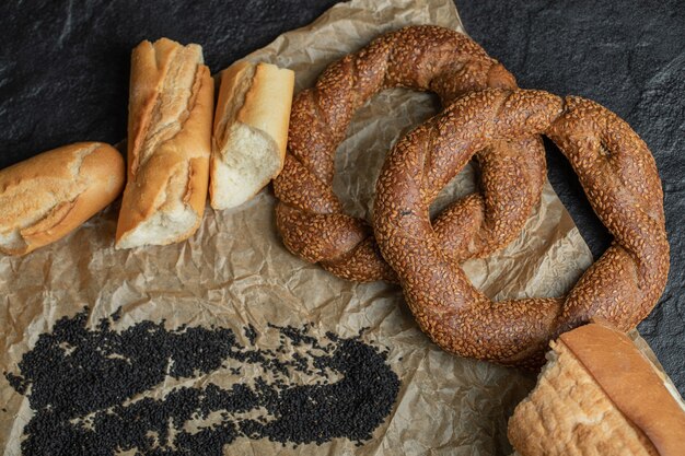 Different types of pastries on parchment paper.