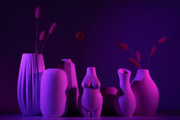 Different vases with purple light arrangement