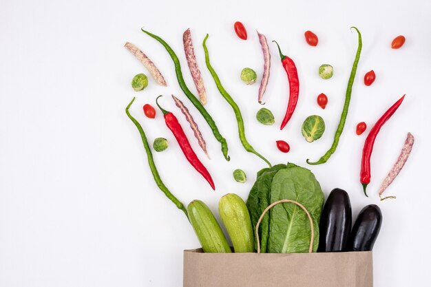 Different vegetables near paper bag