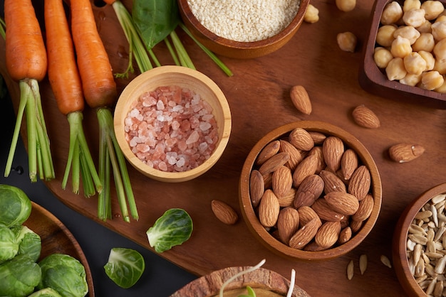 Different vegetables and nuts on table. Flat-lay, top view.