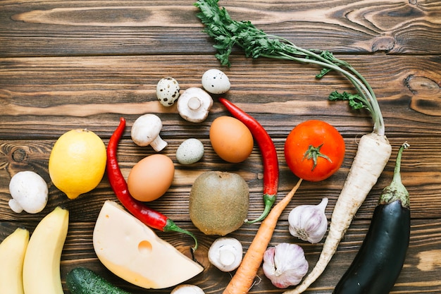 Different vegetables on wooden background