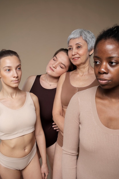 Multi-ethnic group of beautiful women posing in underwear in a beauty  studio - Multicultural fashion models