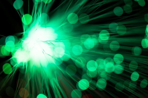 Digital optical fibers in blurred green shades