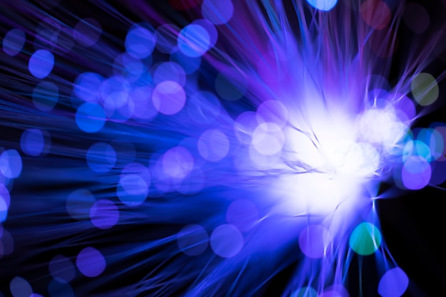 Free photo digital optical fibers in blurred violet shades