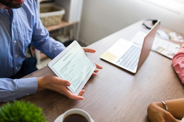 Digital visa application on a tablet. Travel agent asking customers to fill an online permit to go abroad on a vacation holiday