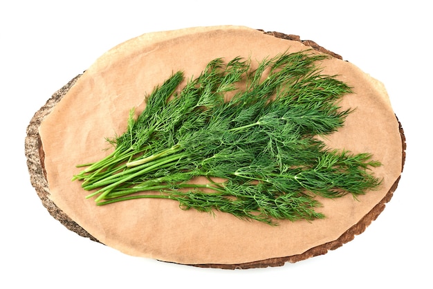 Dill bunch on a wooden platter.