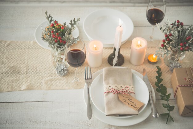 Dinner table decorated with Christmas attributes