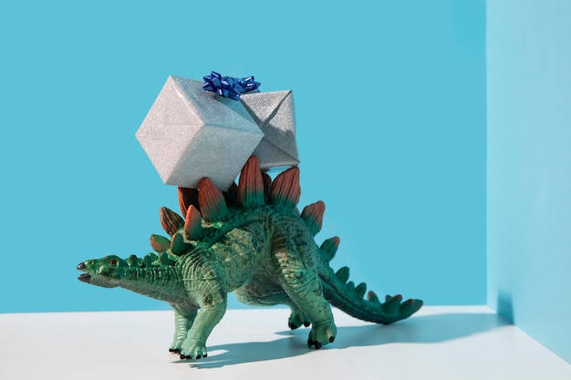 Dinosaur toy wearing presents