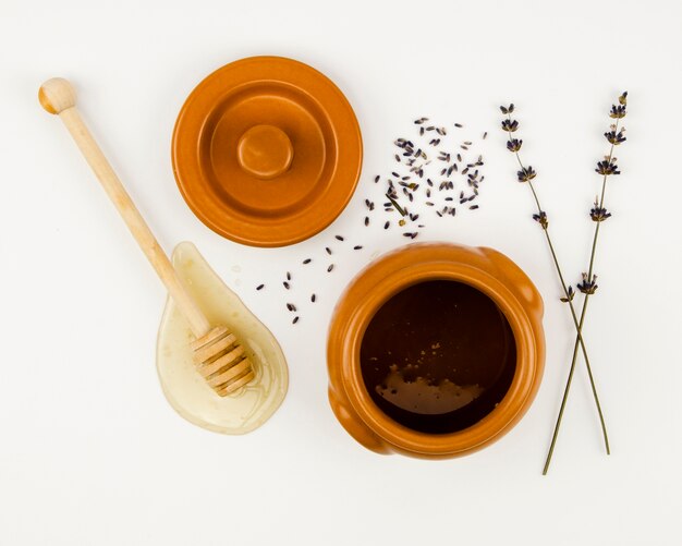 Free photo dipper next to honey container