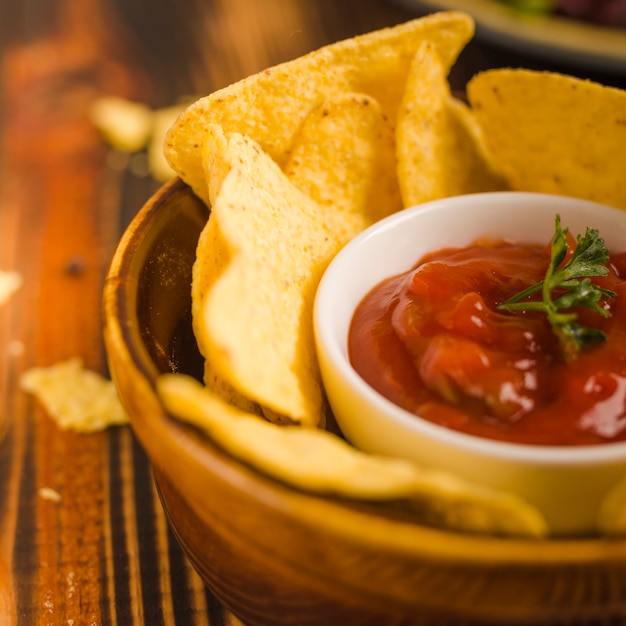 Free photo dipping nacho chips