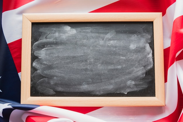 Free photo dirty chalkboard on american flag background