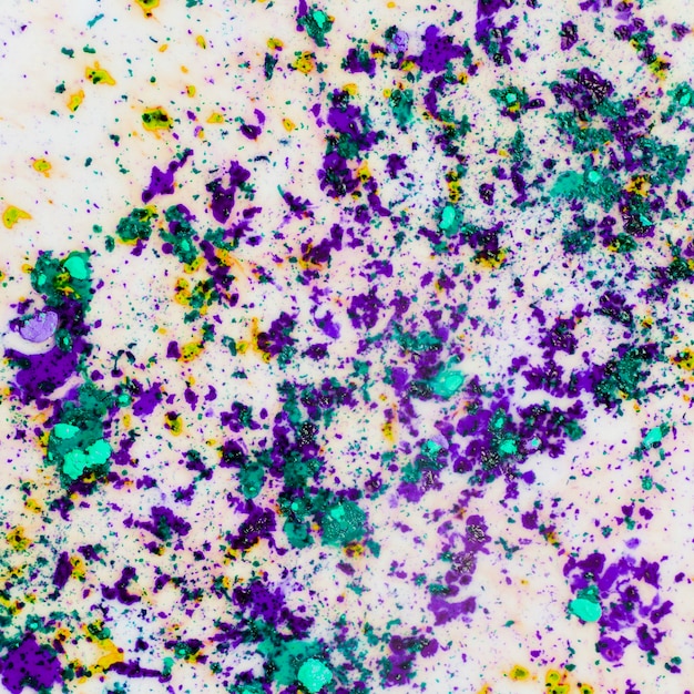 Dirty holi color powder on white surface background