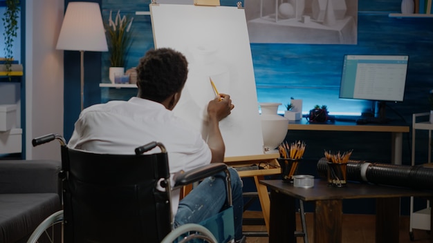 Disabled african american artist working on drawing