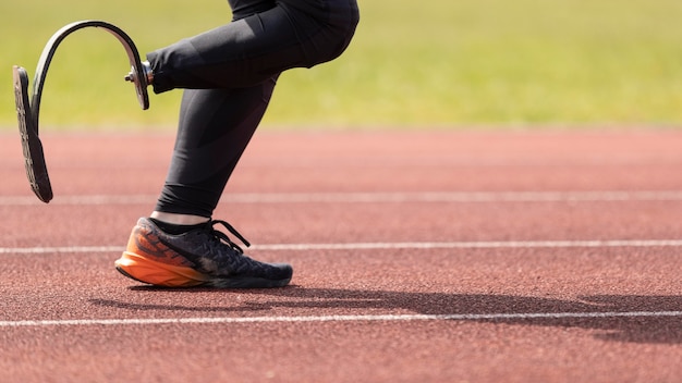 Free photo disabled athlete running close up