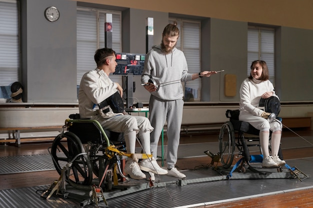 Disabled fencers in special equipment fighting from their wheelchairs