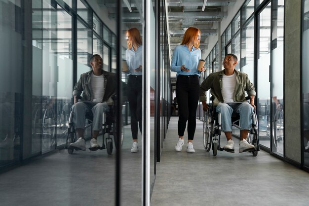 Disabled man in a wheelchair working at his office job