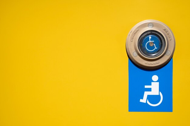 Disabled people symbol with yellow background