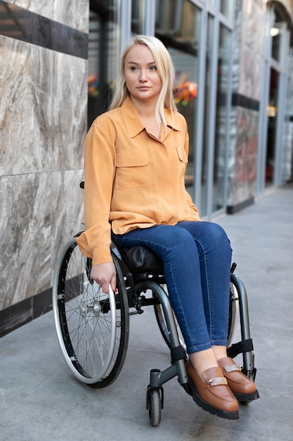 Free photo disabled person in wheelchair on the street