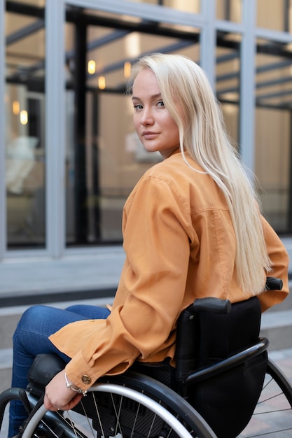 Free photo disabled person in wheelchair on the street