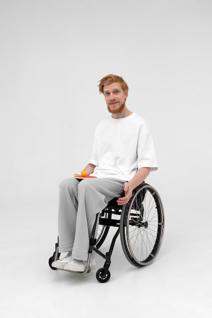 Disabled ping pong player in a wheelchair