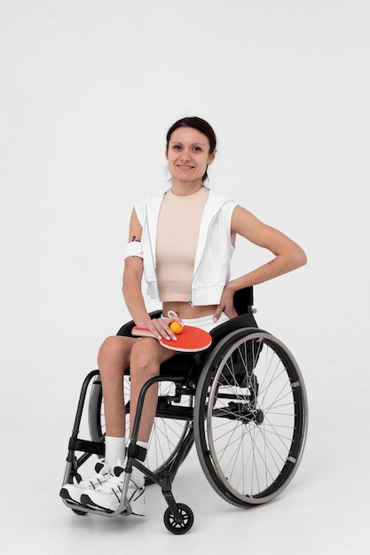 Disabled ping pong player in a wheelchair