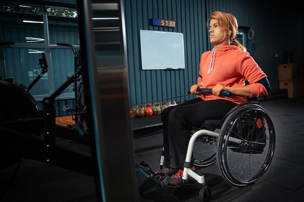 Disabled woman training in the gym of rehabilitation center