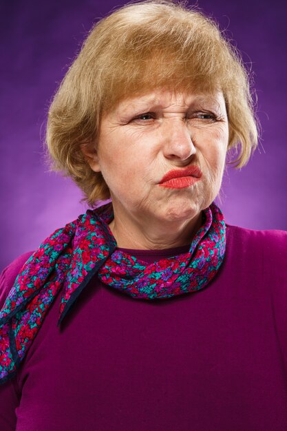 Disaffected senior woman with floral foulard