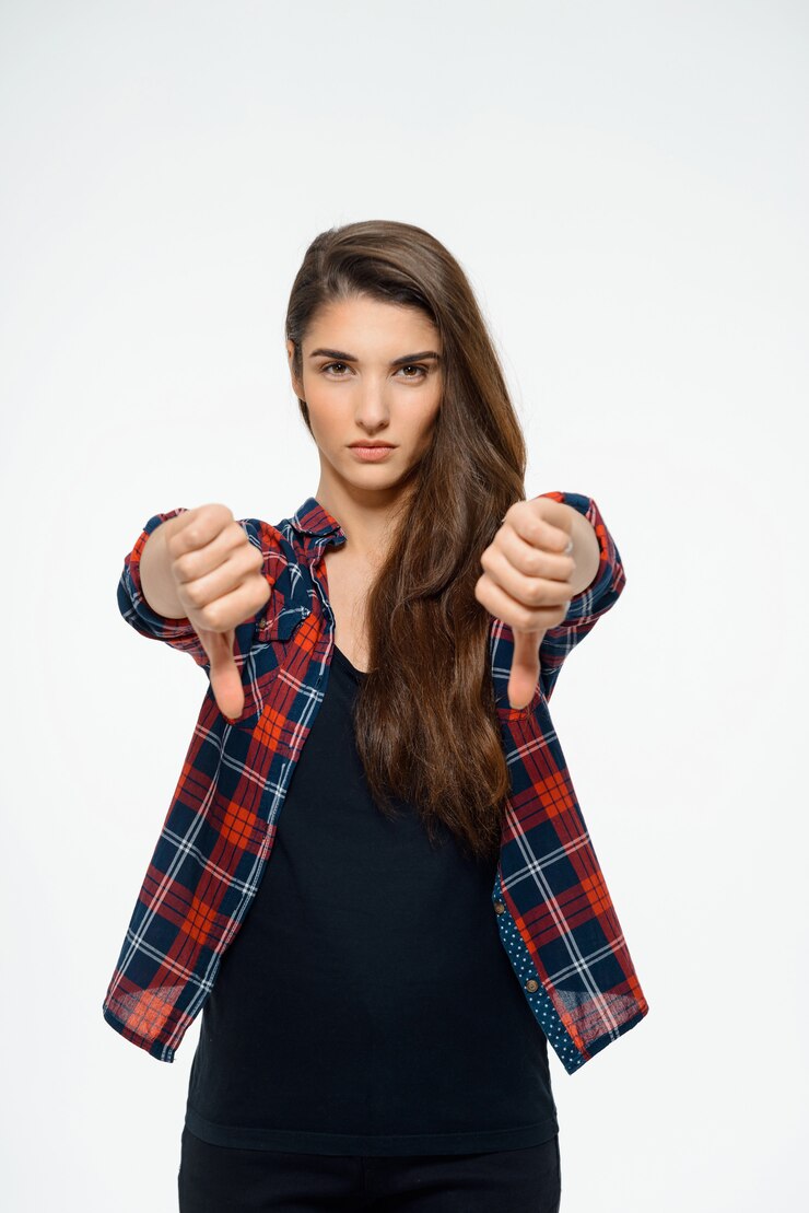 Free Photo disappointed woman show thumbs-down