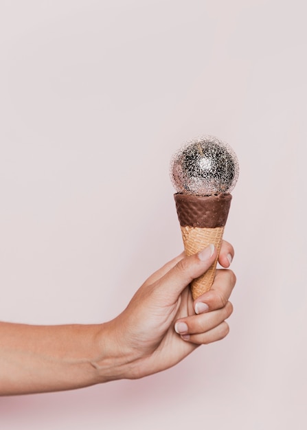 Disco ball on ice cream cone at new years