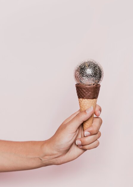 Disco ball on ice cream cone at new years