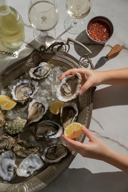 Dish made of oysters with citrus and ice cubes